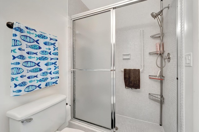 bathroom featuring walk in shower and toilet