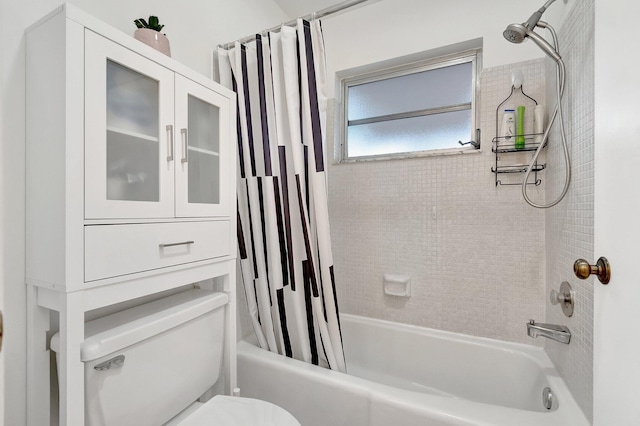 bathroom with toilet and shower / bath combo with shower curtain