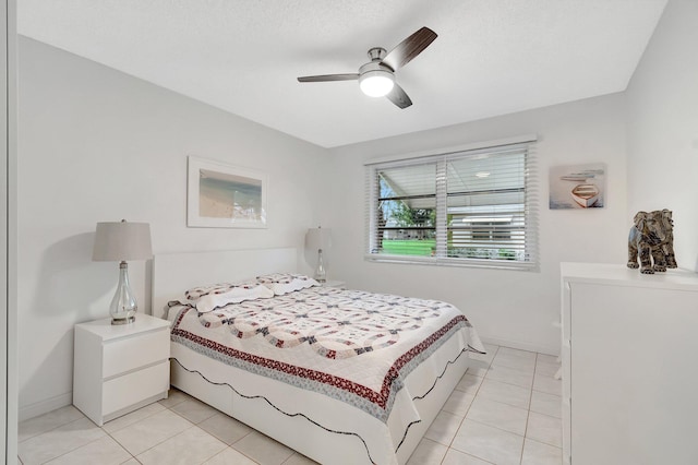 bedroom featuring ceiling fan and light tile patterned flooring