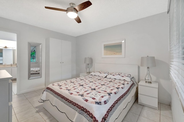 tiled bedroom featuring ceiling fan