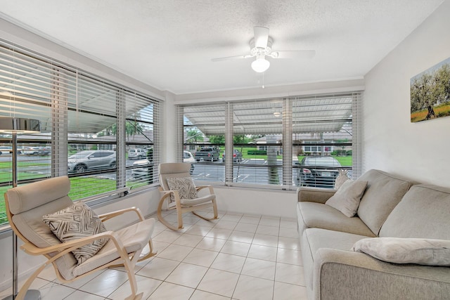 sunroom / solarium featuring ceiling fan