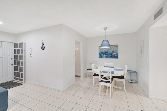 view of tiled dining space