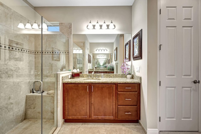 bathroom with tile patterned floors, vanity, and an enclosed shower