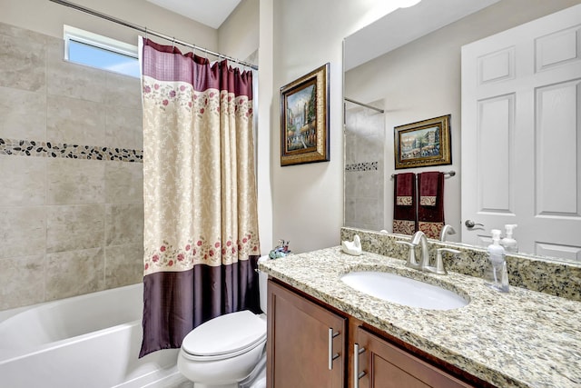 full bathroom with vanity, toilet, and shower / bath combo with shower curtain