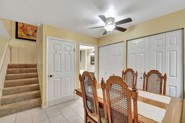 dining room featuring light tile patterned flooring and ceiling fan