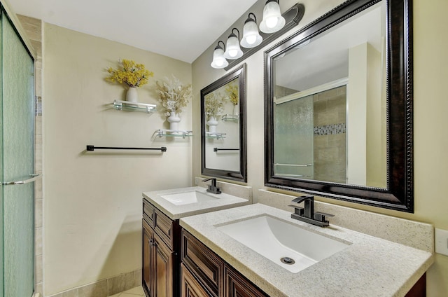 bathroom featuring vanity, an enclosed shower, and tile patterned flooring