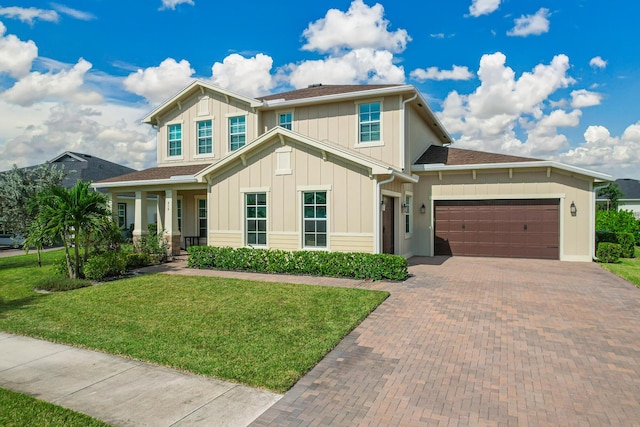 craftsman-style house with a garage, a porch, and a front yard