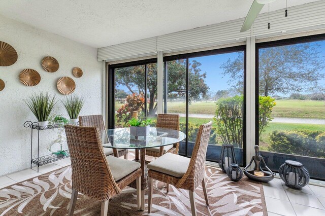 sunroom / solarium with ceiling fan