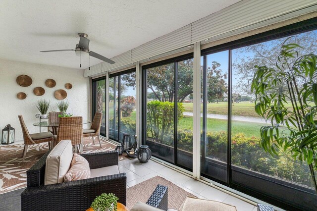 sunroom / solarium with ceiling fan