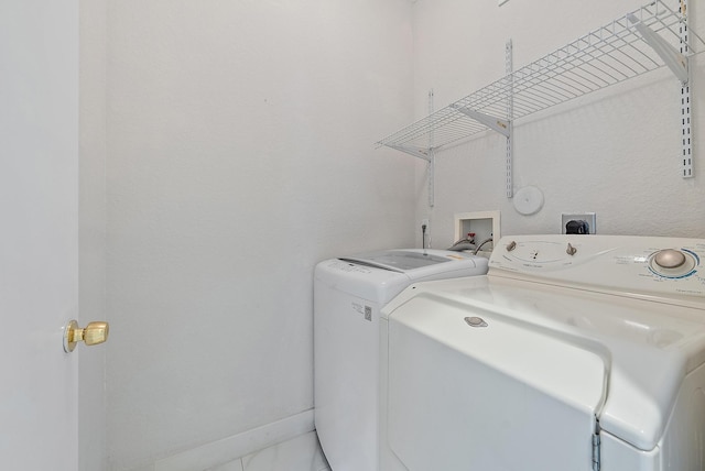 washroom with independent washer and dryer