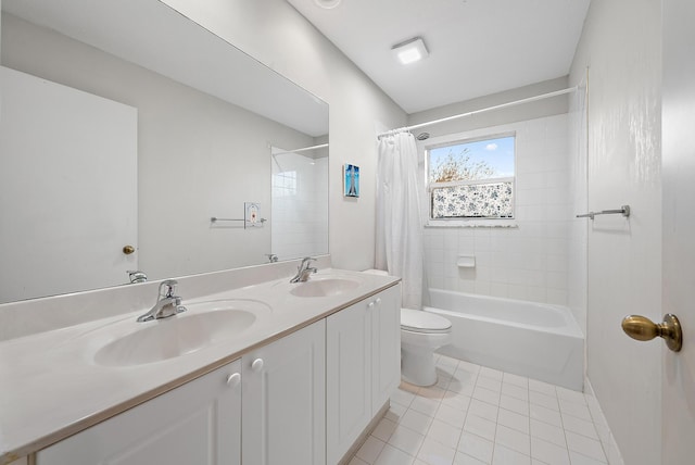 full bathroom with tile patterned floors, toilet, shower / bath combo with shower curtain, and vanity