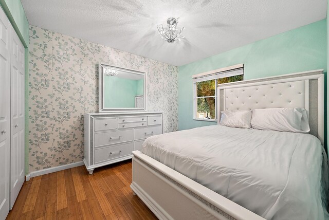 bedroom featuring ceiling fan and light hardwood / wood-style floors