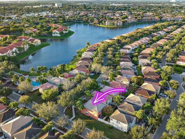 birds eye view of property featuring a water view