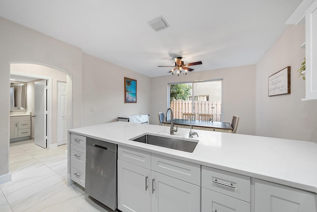 kitchen featuring ceiling fan, dishwasher, and sink