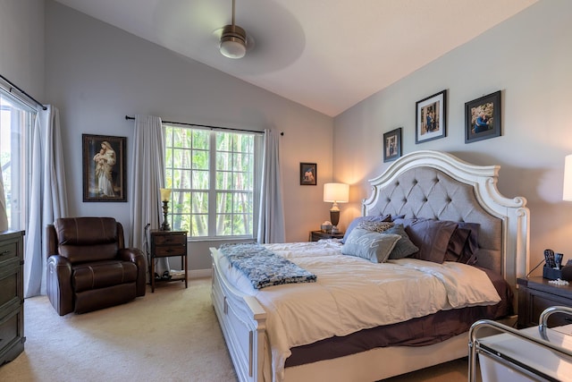 bedroom with vaulted ceiling, light carpet, and ceiling fan