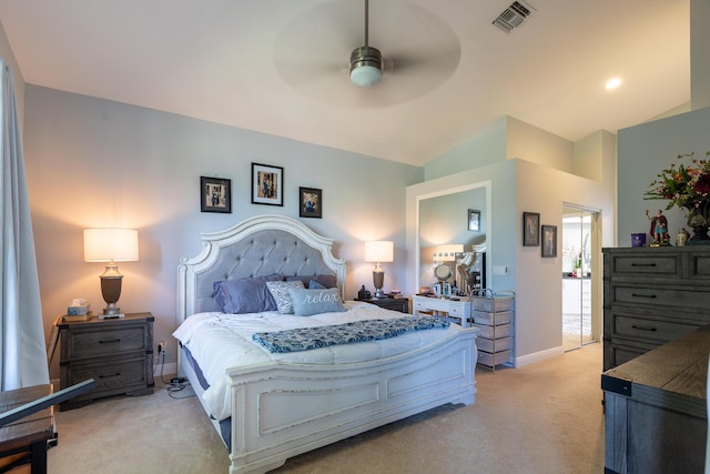 carpeted bedroom with ceiling fan and vaulted ceiling