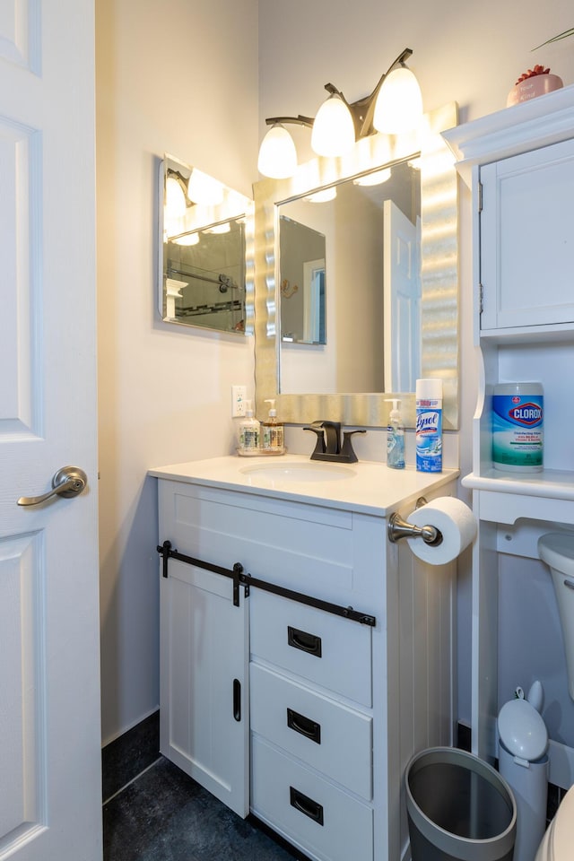 bathroom with vanity and toilet