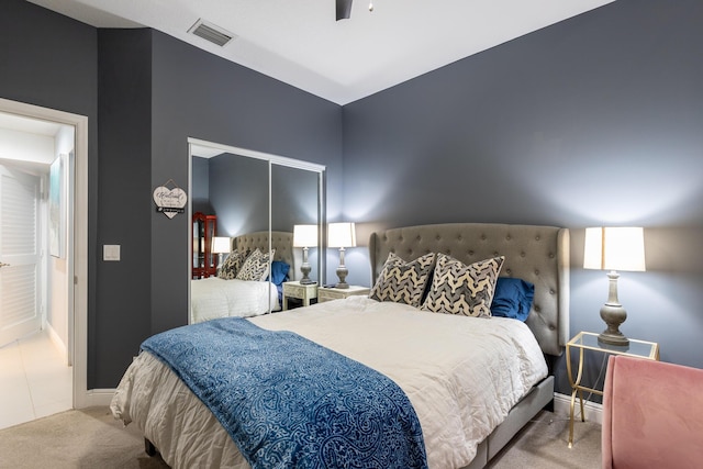 bedroom with light carpet and ceiling fan