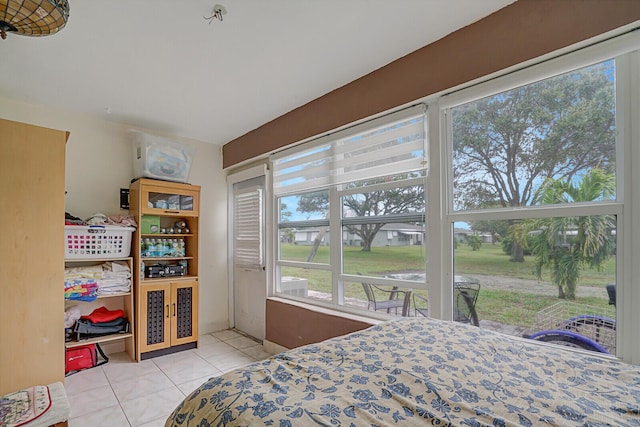 bedroom featuring light tile patterned floors