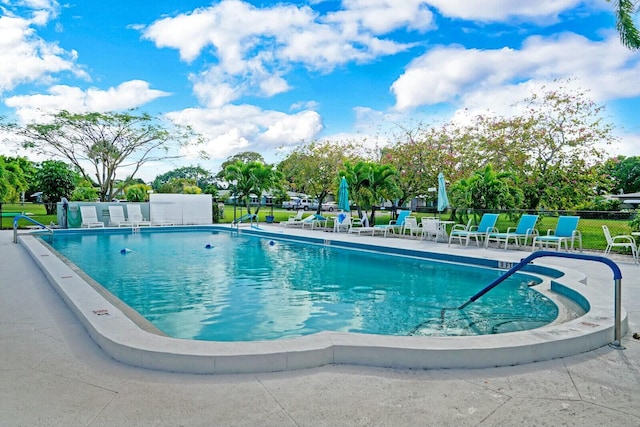 view of swimming pool featuring a patio area