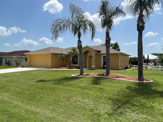 view of front facade featuring a garage and a front yard