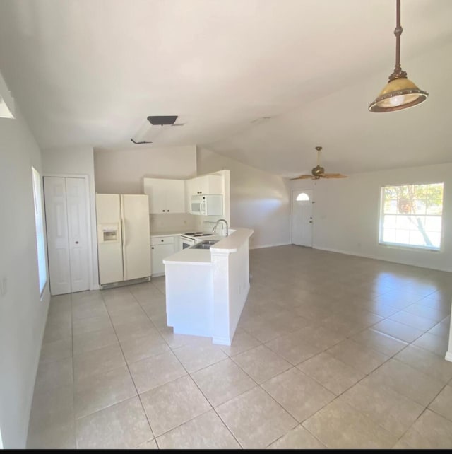 kitchen featuring sink, white cabinets, hanging light fixtures, kitchen peninsula, and white appliances