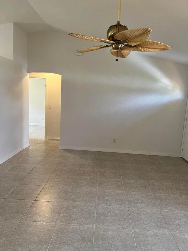 empty room featuring light tile patterned flooring and ceiling fan