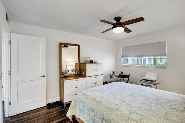 bedroom featuring dark hardwood / wood-style flooring and ceiling fan