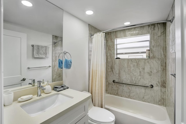 full bathroom featuring vanity, shower / bath combo, and toilet