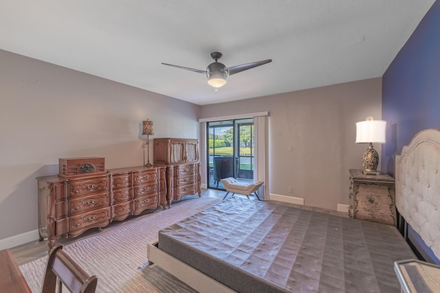 bedroom with access to outside and ceiling fan