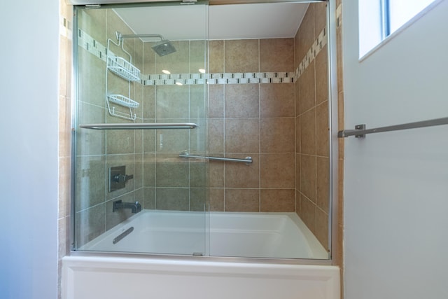 bathroom featuring enclosed tub / shower combo