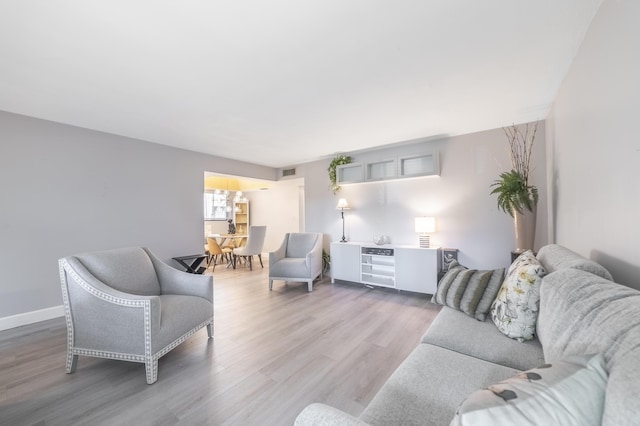 living room with light hardwood / wood-style flooring