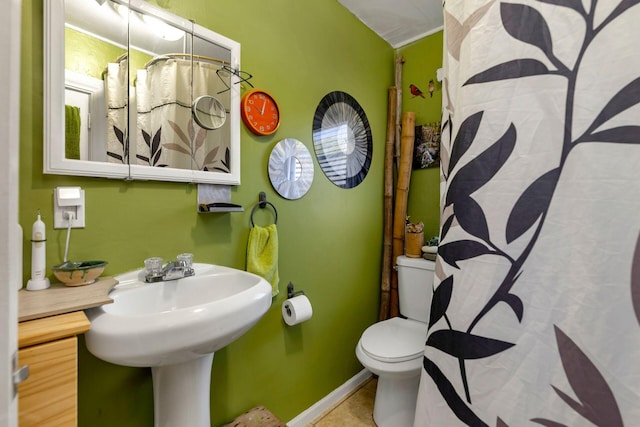 bathroom featuring walk in shower, toilet, and tile patterned flooring