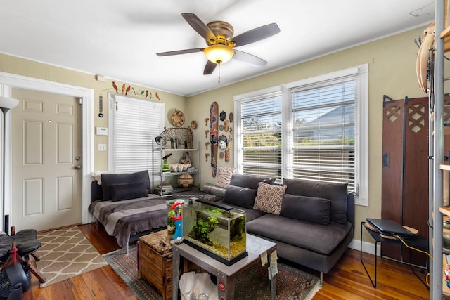 living room with hardwood / wood-style flooring and ceiling fan