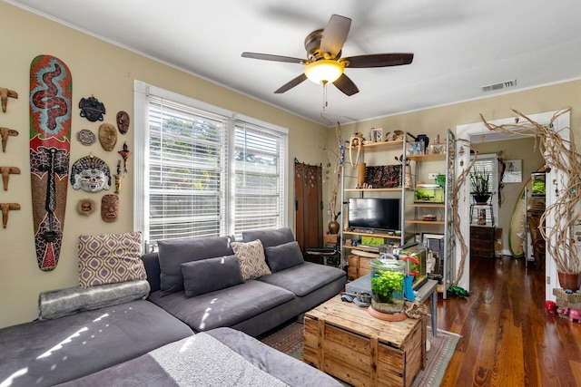 living room with ceiling fan, crown molding, and dark hardwood / wood-style flooring