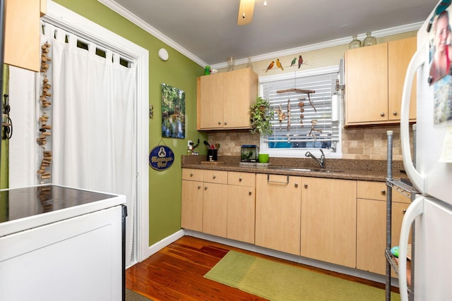 kitchen featuring sink, dark wood-type flooring, ornamental molding, light brown cabinetry, and white fridge