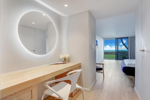 bathroom featuring hardwood / wood-style flooring and floor to ceiling windows