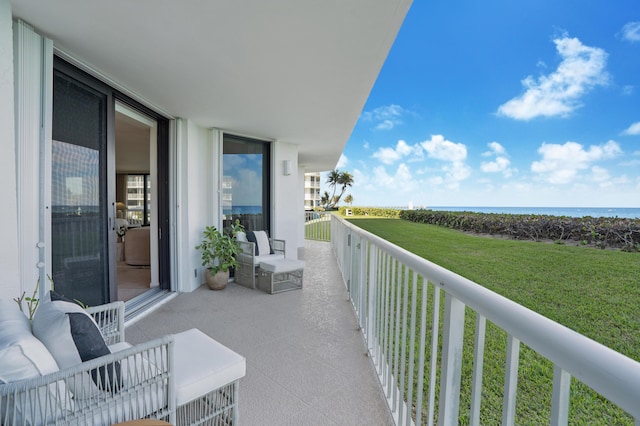 balcony featuring a water view