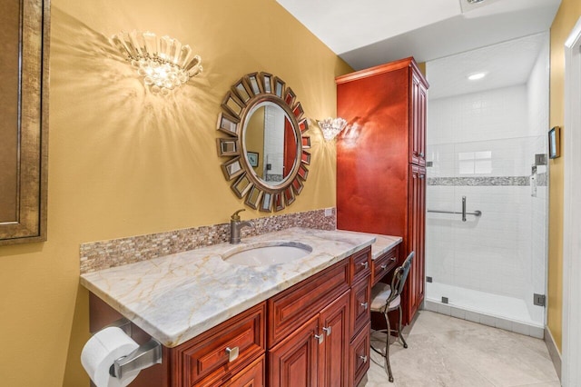 bathroom with vanity, tile patterned floors, and a shower with shower door