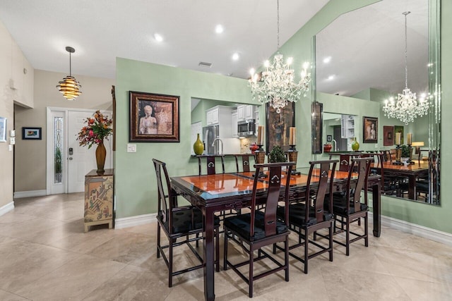 dining room featuring a high ceiling and a notable chandelier