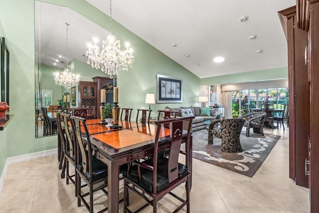 tiled dining space featuring high vaulted ceiling and a notable chandelier