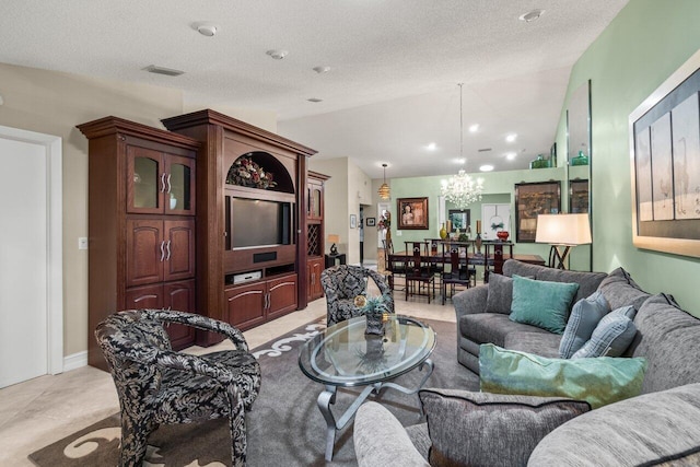 living room with lofted ceiling, a chandelier, and a textured ceiling