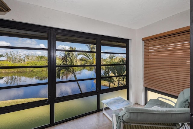 unfurnished sunroom with a water view