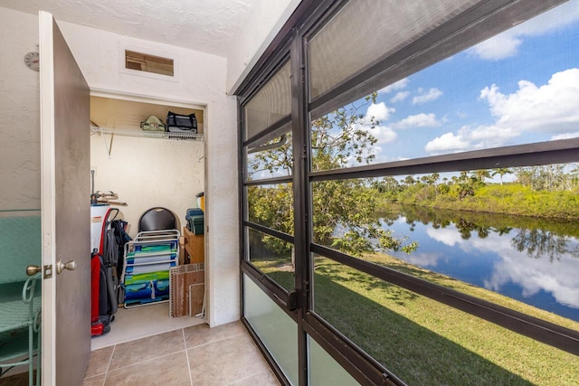 sunroom with a water view