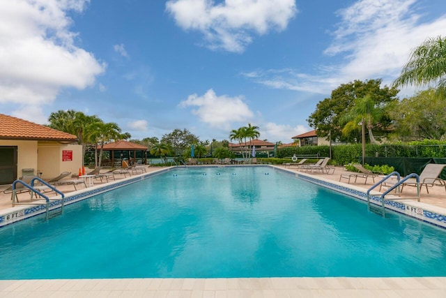 view of swimming pool with a gazebo and a patio area