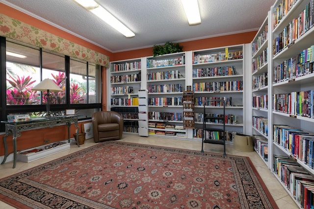 sitting room with light tile patterned floors, crown molding, and a textured ceiling