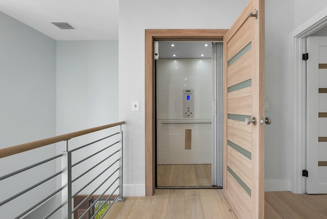 hall featuring light wood-type flooring