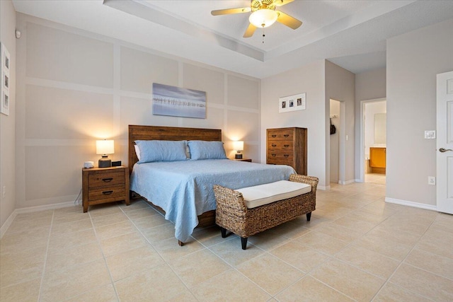 tiled bedroom with a raised ceiling and ceiling fan