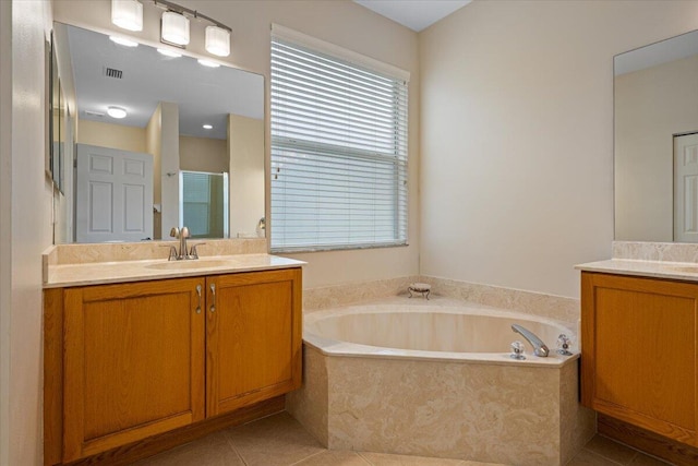 bathroom with vanity, shower with separate bathtub, and tile patterned flooring