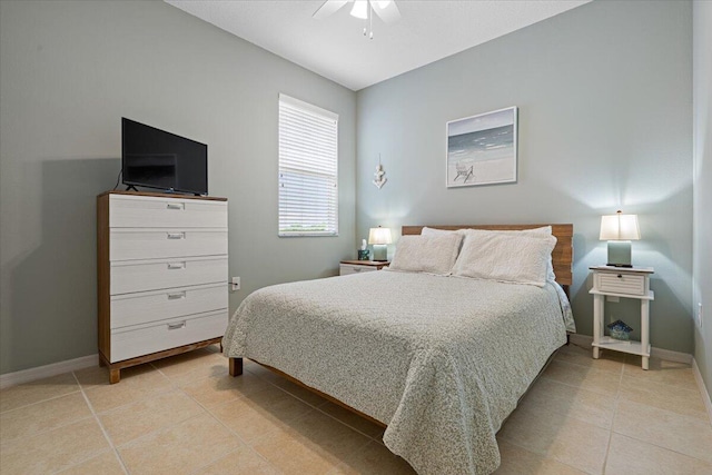 bedroom featuring light tile patterned flooring and ceiling fan